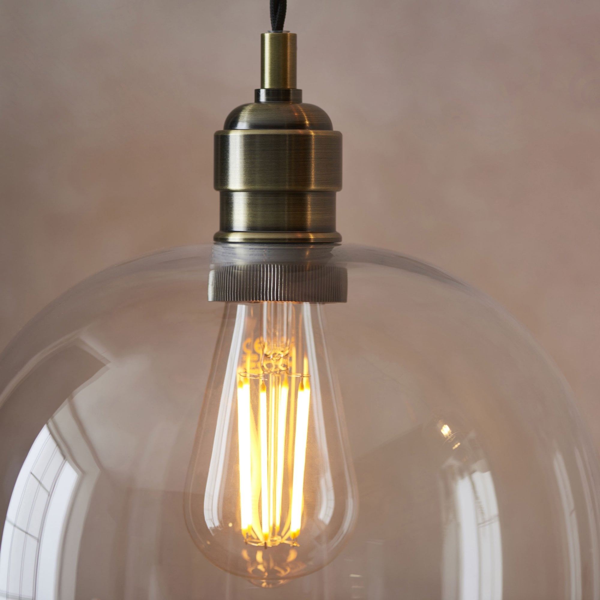 Aurelis – Antique Brass Pendant Light with Clear Glass Bezel