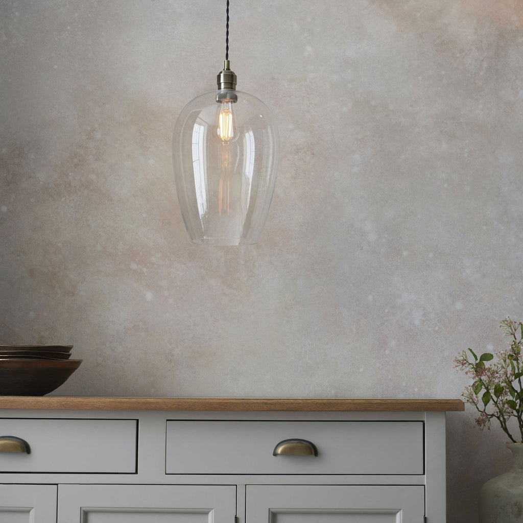 Aurelis – Antique Brass Pendant Light with Clear Glass Bezel