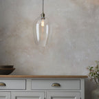 Aurelis – Antique Brass Pendant Light with Clear Glass Bezel