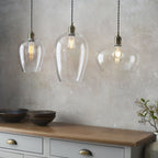 Aurelis – Antique Brass Pendant Light with Clear Glass Bezel
