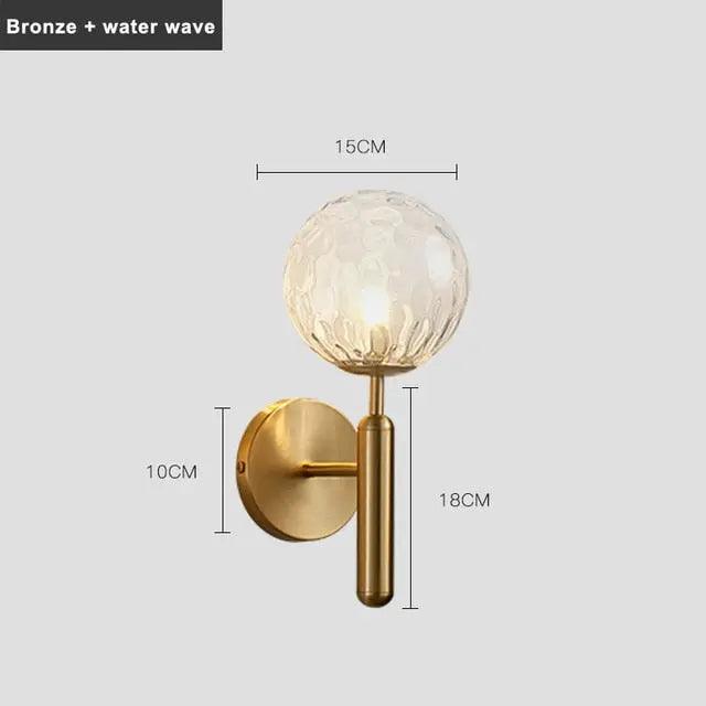 Aurelis – Gold Metal Wall Sconce with Glass Shade