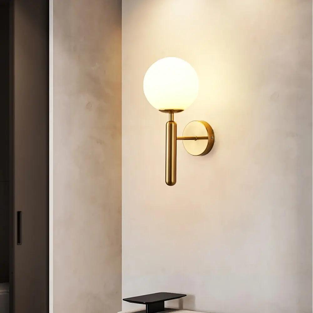 Aurelis – Gold Metal Wall Sconce with Glass Shade
