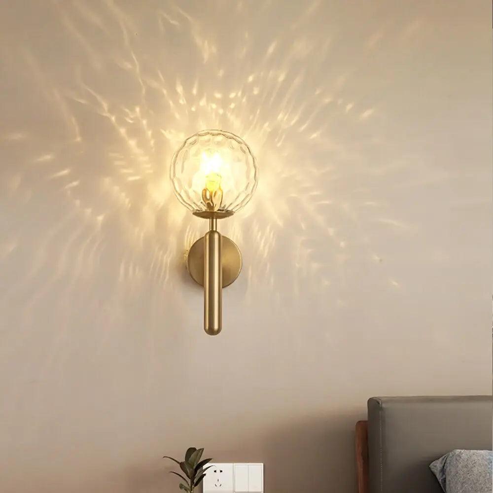 Aurelis – Gold Metal Wall Sconce with Glass Shade