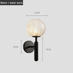 Aurelis – Gold Metal Wall Sconce with Glass Shade