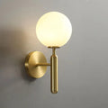 Aurelis – Gold Metal Wall Sconce with Glass Shade