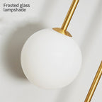 Aurelis – Gold Wall Sconce with White Glass Shade