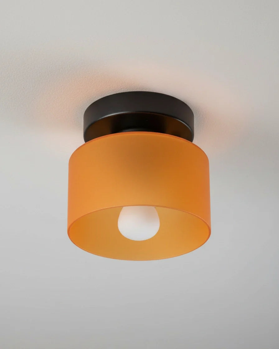 Aurelis round glass plafond in warm orange, flush mounted on a white ceiling, softly lit - detail 4