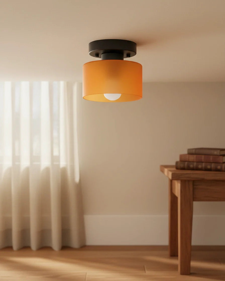 Aurelis round glass plafond in warm orange, flush mounted on a white ceiling, softly lit - Orange