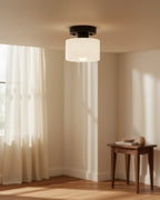 Aurelis round glass plafond in warm orange, flush mounted on a white ceiling, softly lit - White